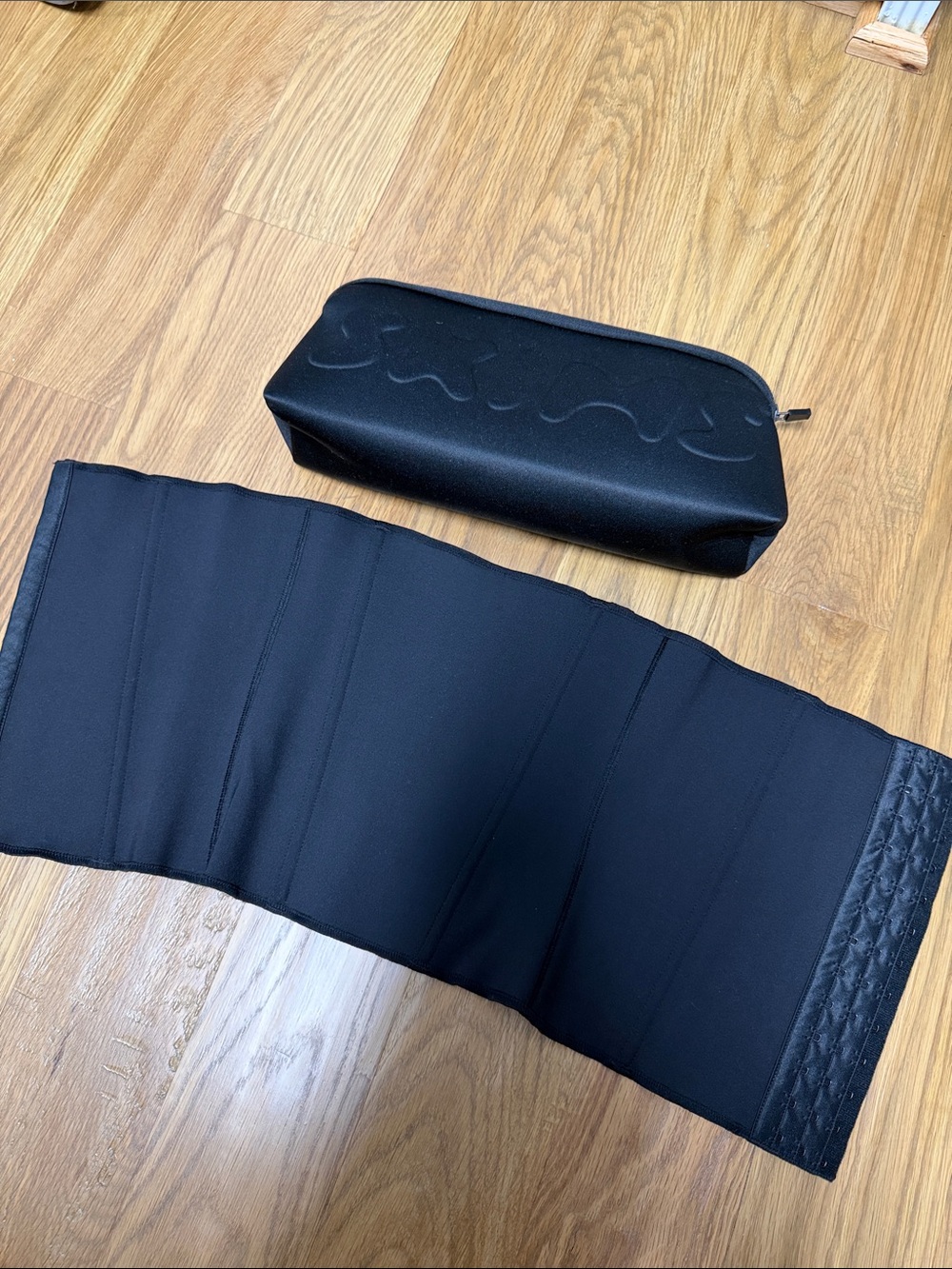 SKIMS Black Waist Trainer with Branded Carry Pouch